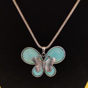 Turquoise Howlite butterfly necklace. 11.5" long.